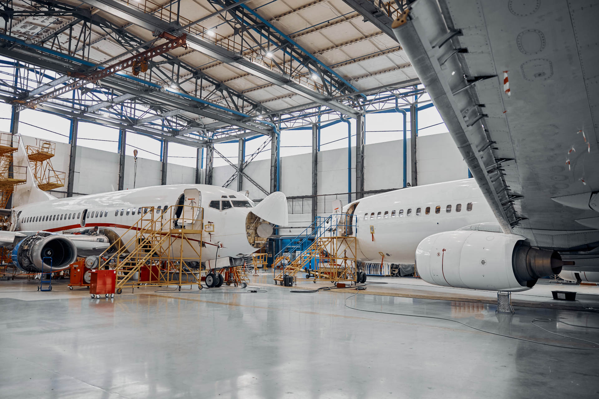 Professional plane expluatation service in big hangar